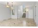 Bright entryway with travertine floors and a staircase leading upstairs at 10796 N 78Th St, Scottsdale, AZ 85260