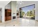 High-ceilinged living room with a large brick fireplace and built-in shelving at 10796 N 78Th St, Scottsdale, AZ 85260