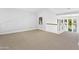 Open loft area with carpeted floor and large windows at 10796 N 78Th St, Scottsdale, AZ 85260