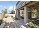 Private patio with stone tile flooring, access to interior, and lush landscaping at 10796 N 78Th St, Scottsdale, AZ 85260