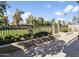 Private patio area with wrought iron fencing and green space beyond at 10796 N 78Th St, Scottsdale, AZ 85260