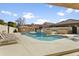 Community pool with lounge chairs and surrounding landscaping at 10796 N 78Th St, Scottsdale, AZ 85260