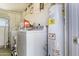 Functional laundry room with washer, dryer, and ample storage at 11111 W Hollywood Ave, Youngtown, AZ 85363