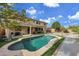 Relaxing backyard with a refreshing pool and patio at 13616 W San Miguel Ave, Litchfield Park, AZ 85340