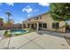 Inviting backyard with a sparkling pool and patio at 13616 W San Miguel Ave, Litchfield Park, AZ 85340