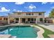 Spacious backyard oasis with a refreshing pool at 13616 W San Miguel Ave, Litchfield Park, AZ 85340