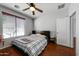 Bright bedroom featuring wood floors and a ceiling fan at 13616 W San Miguel Ave, Litchfield Park, AZ 85340