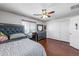 Bright bedroom with wood floors and a plush bed at 13616 W San Miguel Ave, Litchfield Park, AZ 85340