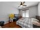 Spacious bedroom with wood floors and a ceiling fan at 13616 W San Miguel Ave, Litchfield Park, AZ 85340