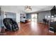 Main bedroom with private balcony access and a massaging chair at 13616 W San Miguel Ave, Litchfield Park, AZ 85340