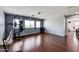 Ample bonus room, hardwood floors, and home gym setup at 13616 W San Miguel Ave, Litchfield Park, AZ 85340