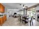 Kitchen and dining area with wood cabinets and tiled floors at 13616 W San Miguel Ave, Litchfield Park, AZ 85340