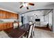 Open concept dining area with hardwood floors and a view to living room at 13616 W San Miguel Ave, Litchfield Park, AZ 85340