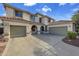 Two-story house with a three-car garage and well-maintained landscaping at 13616 W San Miguel Ave, Litchfield Park, AZ 85340