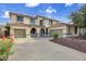 Two-story house with three-car garage and desert landscaping at 13616 W San Miguel Ave, Litchfield Park, AZ 85340