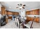 Kitchen with wood cabinets, a kitchen island, and tile flooring at 13616 W San Miguel Ave, Litchfield Park, AZ 85340