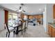 Kitchen boasts wood cabinets, granite counters, and a view of the backyard pool at 13616 W San Miguel Ave, Litchfield Park, AZ 85340