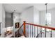 Elegant staircase with wood railings and lighting at 13616 W San Miguel Ave, Litchfield Park, AZ 85340