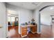 Small study with wooden desk and granite countertop at 13616 W San Miguel Ave, Litchfield Park, AZ 85340