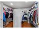 Large walk-in closet with ample shelving and hanging space at 13616 W San Miguel Ave, Litchfield Park, AZ 85340
