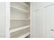 White pantry with multiple shelves for ample storage at 13717 S Huntington Rd, Arizona City, AZ 85123