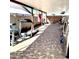 Spacious backyard with covered patio, exercise equipment, and a large tile area at 143 W Michelle Dr, Phoenix, AZ 85023