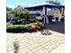 Landscaped backyard with patio, gazebo, and lush greenery at 143 W Michelle Dr, Phoenix, AZ 85023