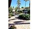 Landscaped backyard with a fountain and patio at 143 W Michelle Dr, Phoenix, AZ 85023