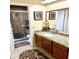Bathroom with granite vanity and a shower at 143 W Michelle Dr, Phoenix, AZ 85023