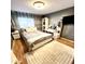 Bedroom with a bed, a vanity, and wood floors at 143 W Michelle Dr, Phoenix, AZ 85023