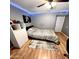 Bedroom with wood floors, a bed, and LED lighting at 143 W Michelle Dr, Phoenix, AZ 85023