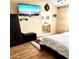 Bedroom with ensuite bathroom access and TV at 143 W Michelle Dr, Phoenix, AZ 85023