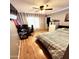 Bedroom with wood floors, a bed, and a workspace at 143 W Michelle Dr, Phoenix, AZ 85023
