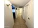 Clean hallway with tiled floors and neutral colors at 143 W Michelle Dr, Phoenix, AZ 85023