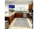 Spacious kitchen with granite countertops and wooden cabinets at 143 W Michelle Dr, Phoenix, AZ 85023