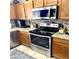 Stainless steel appliances and granite countertops in this kitchen at 143 W Michelle Dr, Phoenix, AZ 85023