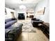 Living room with view into dining room and fireplace at 143 W Michelle Dr, Phoenix, AZ 85023