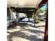 Covered patio with swing and small seating area at 143 W Michelle Dr, Phoenix, AZ 85023