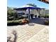 Large backyard patio with seating area and shade structure at 143 W Michelle Dr, Phoenix, AZ 85023