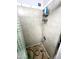 Shower stall with tiled walls and patterned floor at 143 W Michelle Dr, Phoenix, AZ 85023