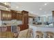 Spacious kitchen with granite countertops and dark wood cabinets at 16486 W Chuparosa Ln, Surprise, AZ 85387