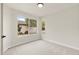 Bright bedroom with carpet flooring and a large window at 1651 E Countrywalk Ln, Chandler, AZ 85225