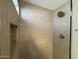 Walk-in shower with neutral tile and gold fixtures at 1651 E Countrywalk Ln, Chandler, AZ 85225