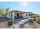 Backyard view showing patio, landscaping, and home at 17510 W Glenhaven Dr, Goodyear, AZ 85338