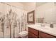 Small bathroom with a shower/tub combo and wood vanity at 17510 W Glenhaven Dr, Goodyear, AZ 85338