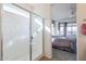 Bathroom with a shower and a view into a bedroom at 17510 W Glenhaven Dr, Goodyear, AZ 85338