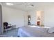 Bright bedroom with carpeted floor, ceiling fan, and ensuite bathroom access at 17510 W Glenhaven Dr, Goodyear, AZ 85338