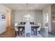 Bright dining area featuring a table for four and tasteful artwork at 17510 W Glenhaven Dr, Goodyear, AZ 85338