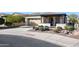 Single story home with attached garage and desert landscaping at 17510 W Glenhaven Dr, Goodyear, AZ 85338