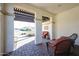 Covered patio with seating area and view of neighborhood at 17510 W Glenhaven Dr, Goodyear, AZ 85338